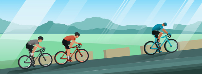 Cyclists ride uphill. Race among the mountains on a beautiful sunny day. Hilly terrain. The leader of the race looks back at the pursuers.