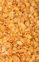 Cornflakes background, texture. Crispy cereal breakfast top view
