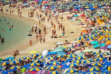 Sunny day at the beach full of people, Playa de los Amadores, Gran Canaria