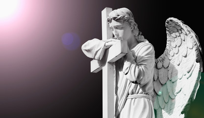 Angel with cross. Suffering and death