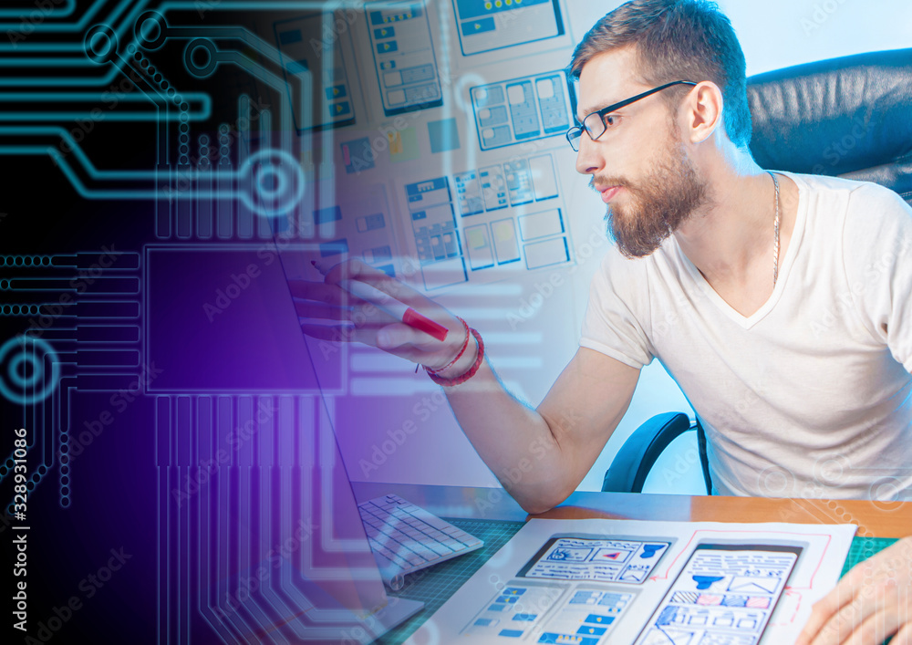 Poster a man works in a web studio. a man works in an office. concept - creating a website layout. concept 