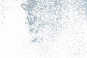 Close up water bubbles underwater on white background.