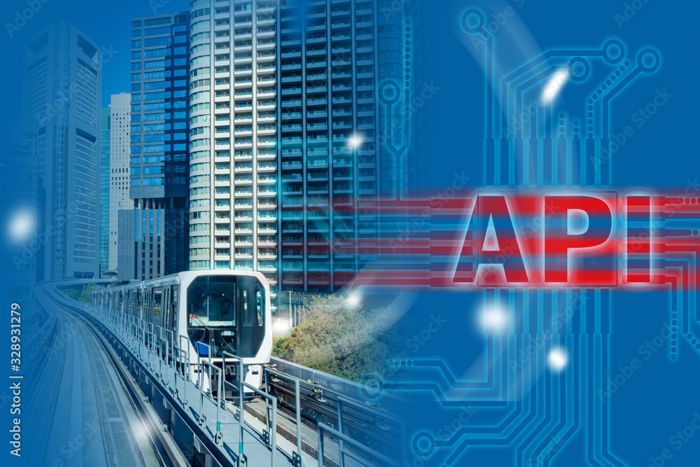 Poster api logo next to a train. the train rides next to a skyscraper. development of an api interface for 