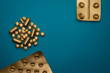 group of pills and blisters on blue background - 328932492