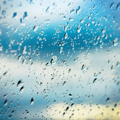 Blurred Raindrops On Window Glass - 328933836