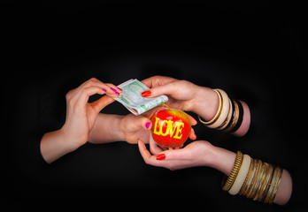Women offering money and taking apple with word love