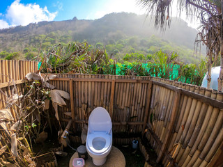 A luxury toilet hidden in the middle of a jungle next to Nyang Nyang Beach, Bali, Indonesia. The...