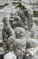 A close up on a guardian figure of Ganesha in the Uluwatu Temple, Bali, Indonesia. Traditional and historical site. Elephant-headed Hindu god of beginnings. Detailed portraying