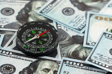 compass on money, the concept of currency exchange rate development