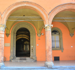 Fototapeta na wymiar Entrance to one of the Medieval universities at Via Zamboni; Place of study of Adam Mickiewicz