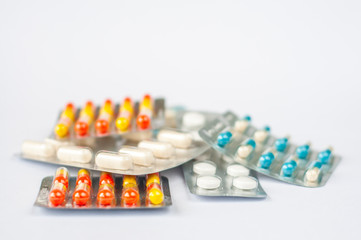 Closeup colorful antibiotics capsule pills in blister pack Pharmacy background. Antimicrobial drug resistance. Pharmaceutical industry. Global healthcare.