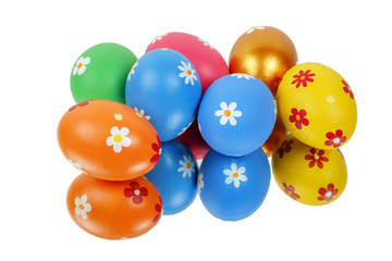 Bunch of colorful painted Easter eggs reflected on the white surface