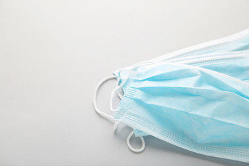 Medical masks on a grey background with copy space. Coronavirus