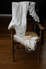 Vintage underwear draped over a wooden chair