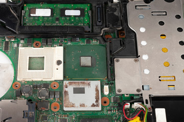 Close up empty socket for CPU and  integrated graphics card on laptop main board on white background