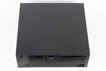 The old desktop computer, PC with floppy disk drive and cd drive on white background
