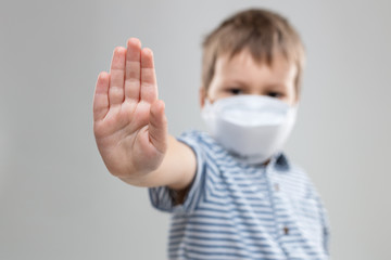 Young child wearing a respiratory mask as a prevention against the Coronavirus Covid-19
