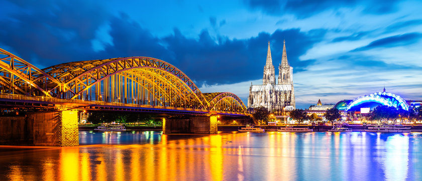 Cologne at night with illuminated Cologne Cathedral, Hohenzollern Bridge and Rhine River