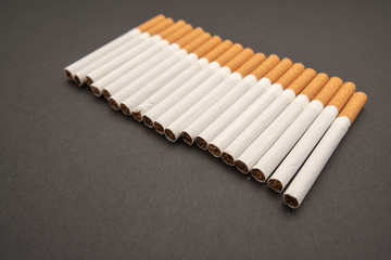 Cigarettes on black background close-up. Harmful to health. Bad habit.