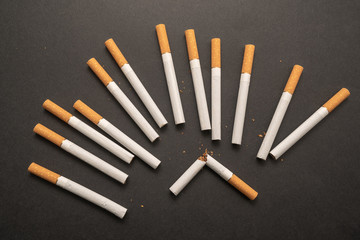 Cigarettes on black background close-up. Harmful to health. Bad habit.