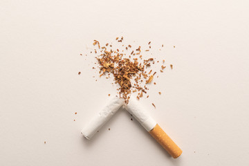 Broken cigarette on white background, World No Tobacco Day. Lung health concept.