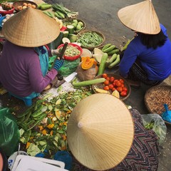 fresh fruit and vegetables merchants at vietnamese market