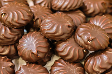 Background and texture of chocolate marshmallows sweets.