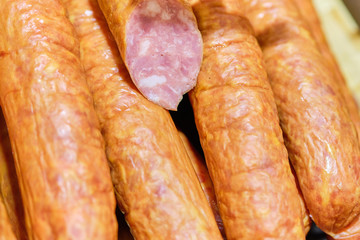 Sausage meat in the cut on the store counter.