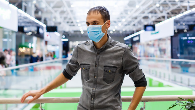 Man wearing mask for protect Novel Coronavirus:2019 or PM 2.5 dust and serious of the air pollution in department store. - Powered by Adobe