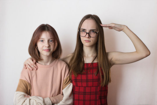 stepsisters or friends children teens not like each other on a white background