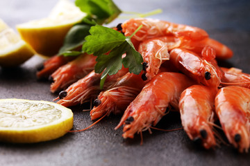 Raw fresh Prawns Langostino Austral. shrimp seafood with lemon and spices on background
