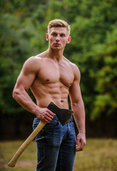 Surviving in wild nature. Brutality is sexy. Strength and power concept. Sexy macho bare torso....