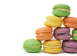 round baked multi-colored almond flour cakes macarons, dessert is laid in a stack