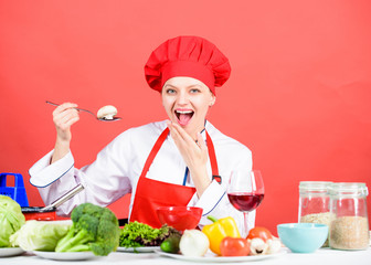 Cooking meal. Girl at kitchen table. Cooking food and housekeeping. Housewife routine. Cooking healthy food. Professional cooking tips. Woman chef try taste eat food. Delicious recipe concept