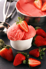 Strawberry ice cream scoop with fresh strawberries and icecream