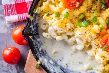 delicious pasta and cheese casserole in a cast iron skillet