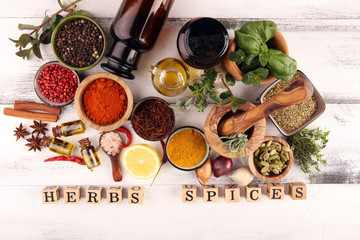 Spices and herbs on table. Food and cuisine ingredients with pepper and spices herbs sign with...