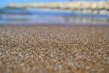 Tropical sandy beach with blurred background of sea waves