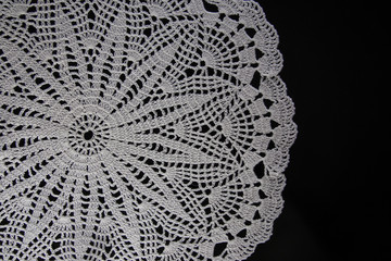 white lace on black background, crochet