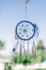 Dreamcatcher made with different feathers and strings