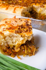 freshly baked cabbage pie on rustic wooden background