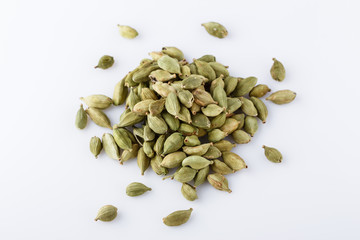 fragrant green cardamom on a white acrylic background