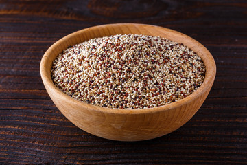 mix of quinoa grains on dark wooden rustic background