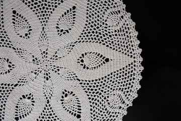 white lace on black background, crochet