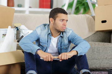 tired young man resting on the floor