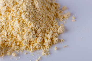 natural corn flour on white acrylic background