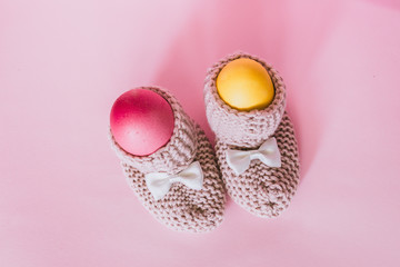 two easter eggs in slippers