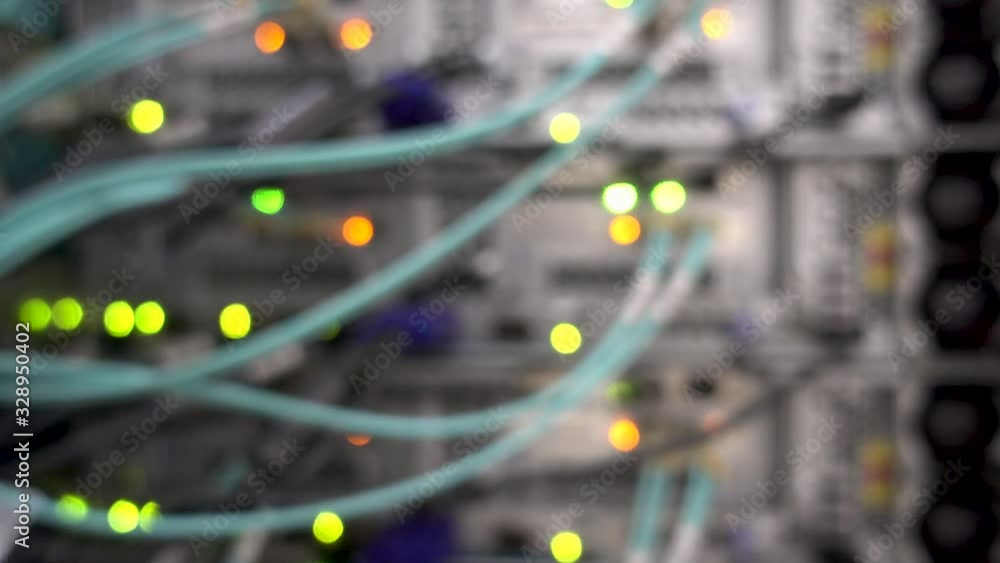 Poster orange and yellow bokeh led lights blinking on back side of working data server