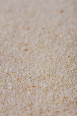 natural organic semolina on white acrylic background