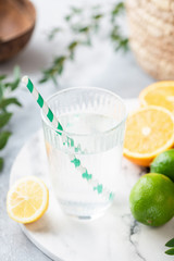 Cool citrus water on marble table. Refreshing cold summer drink
